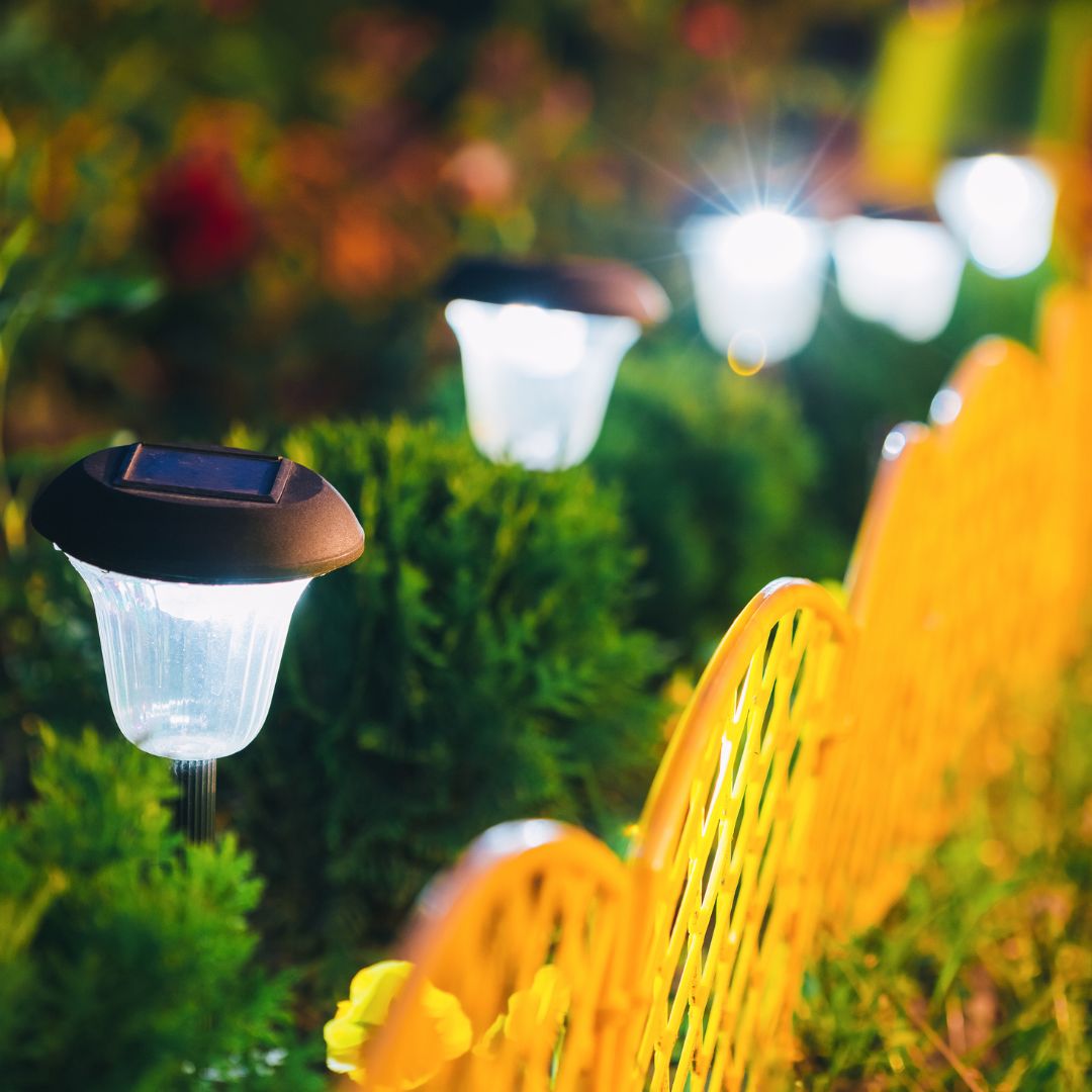 Solar-powered outdoor lights in a garden setting with a blurred background